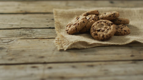 video of biscuits with chocolate on wooden background