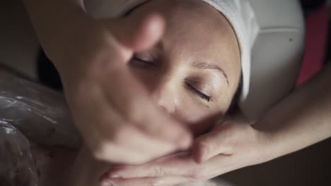 woman receiving a facial massage