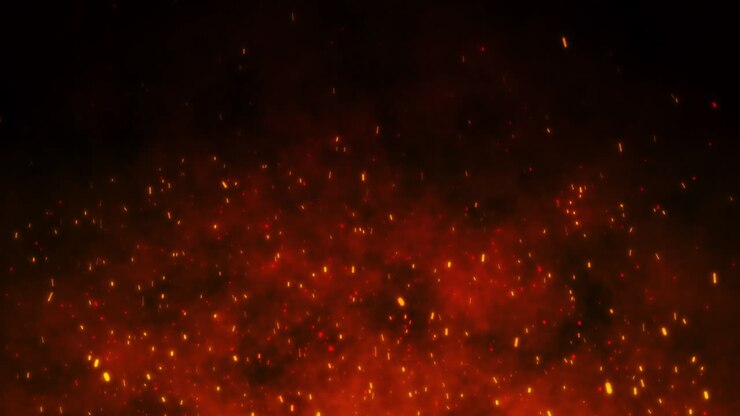 Fire embers particles over black background.