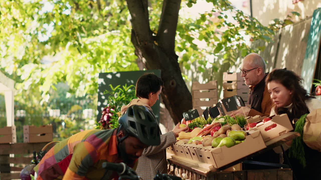 People shopping at a farmers market