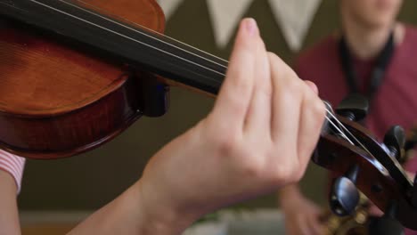 teenage musicians rehearsing