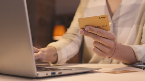 woman using laptop and credit card for online payment