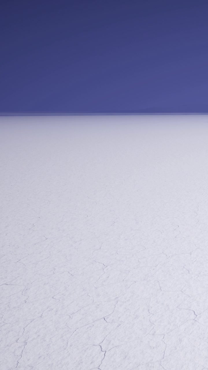 Wide expanse of cracked salt flat under a clear sky at sunset