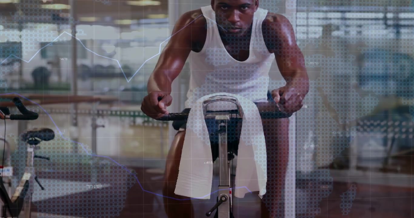 Camera pulling back, man cycling gym bike, causing bar charts showing data while hydrating