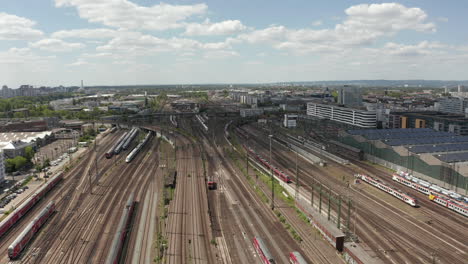 AERIAL:-Forward-Flight-over-Train-Tracks-on-beautiful-Summer-Day-with-little-Traffic-due-to-Coronavirus-Covid-19-Pandemic