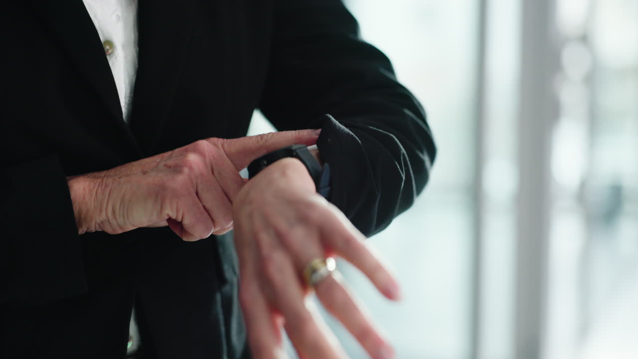 Close-up of a woman using a smartwatch