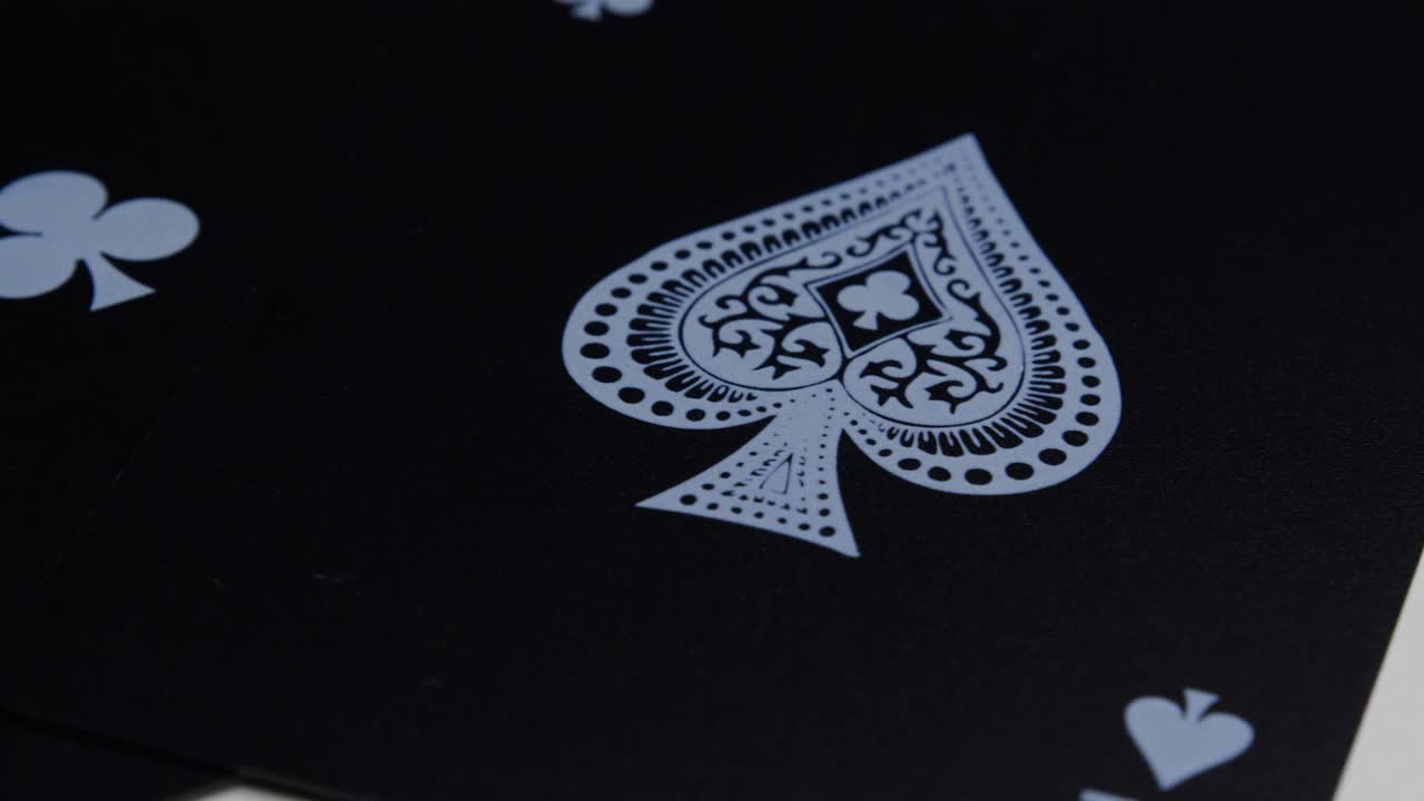 Macro view of the ace of spades of a black deck of cards