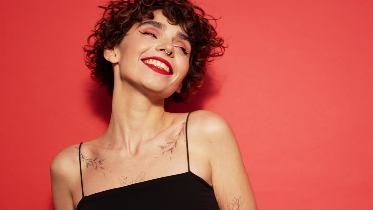 Young beautiful smiling woman in studio