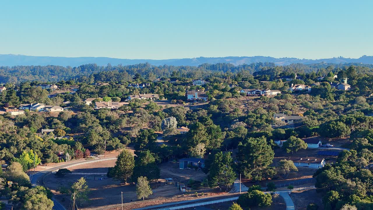 Rural Hillside Neighborhood With Homes and Dense Trees in Central California