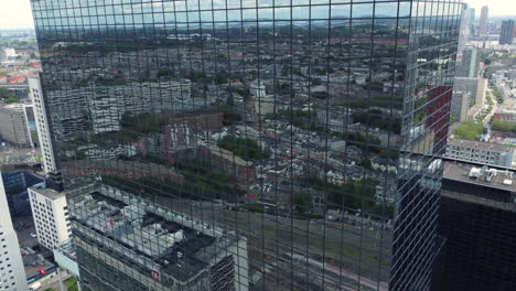 reflection of a city in a skyscraper