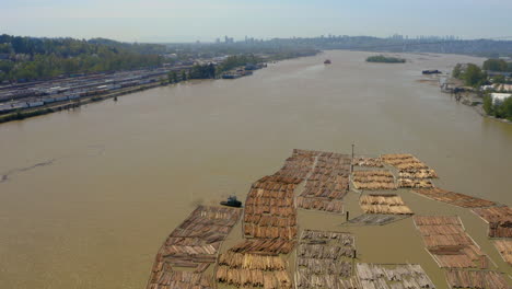 Aerial-view-of-floating-log-booms-in-the-Fraser-River-in-Vancouver,-British-Columbia,-Canada
