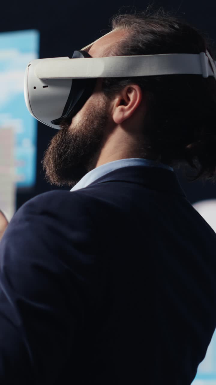 Vertical Video Modern businessman employs virtual reality headset in a digital environment