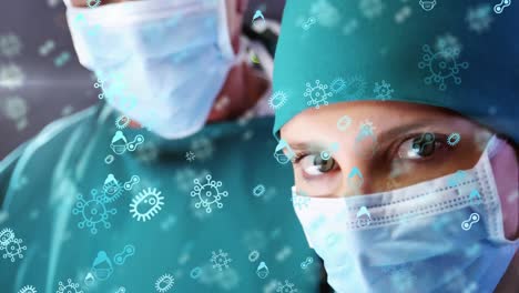 Animation-of-surgeons-with-protective-masks-and-suit-over-multiple-virus-and-bacteries-icons