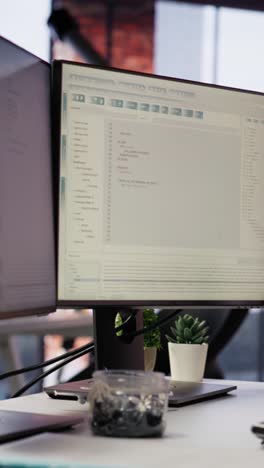 vertical video coding platform on pc screens in empty silicon valley startup office