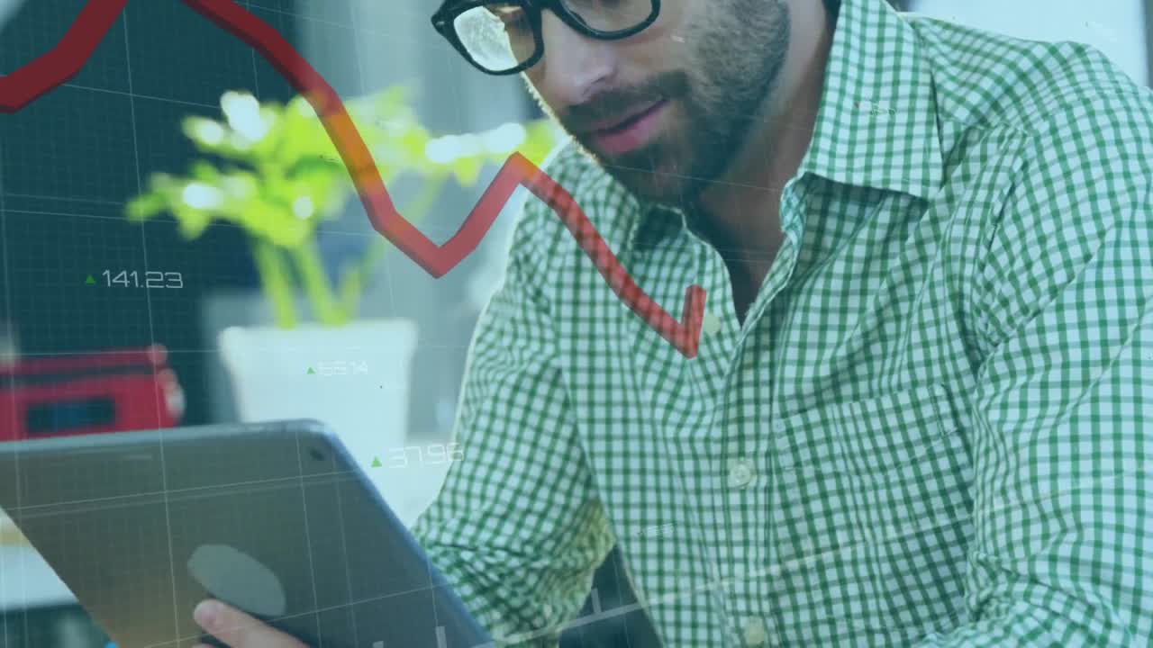Animation of financial data processing with red line over caucasian businessman using tablet