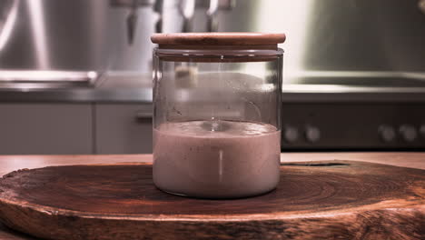 Bubbles-Formed-In-Sourdough-Starter-Because-Of-Wild-Yeast---Bubbly-And-Billowy-Stage-Of-Sourdough-Starter-On-A-Glass-Jar