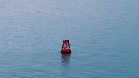 lone buoy warning vessels and ships of positions of submerged objects in shallow ocean seas 4k