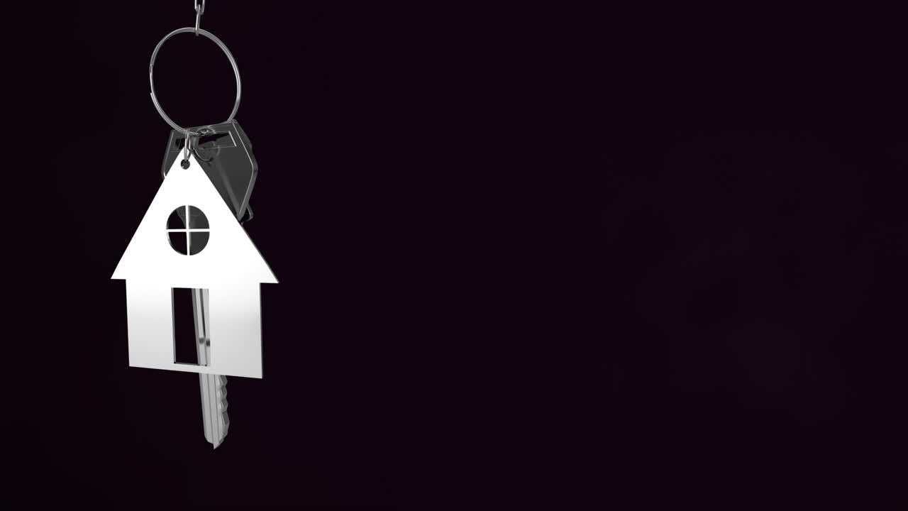 animación de llaves de casa de plata colgando contra un fondo negro con espacio de copia