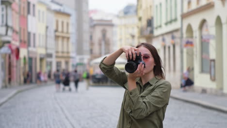 woman photographer in a european city street