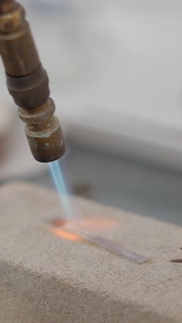 heating metal with a torch