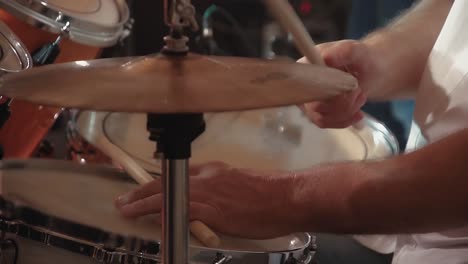 drummer plays percussion instruments at a concert