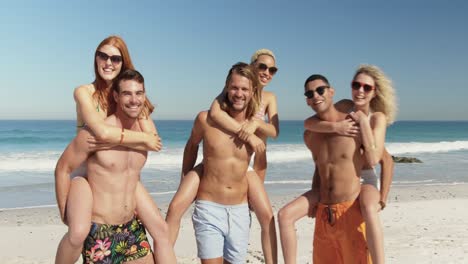 young adult friends having fun at the beach 4k
