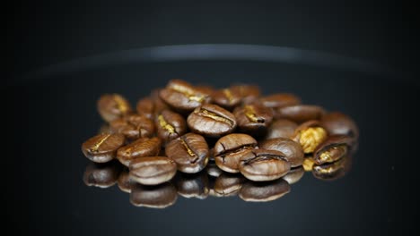 Dark-Coffee-Beans-With-Reflection-On-Surface