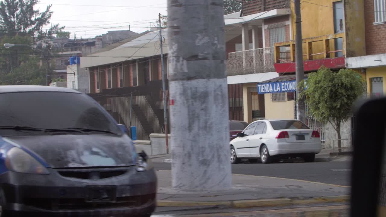 Motorcyclist Riding Through a City Street in Mexico