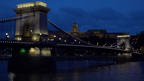 night view beside an illuminated bridge over the danube river in budapest hungary 1