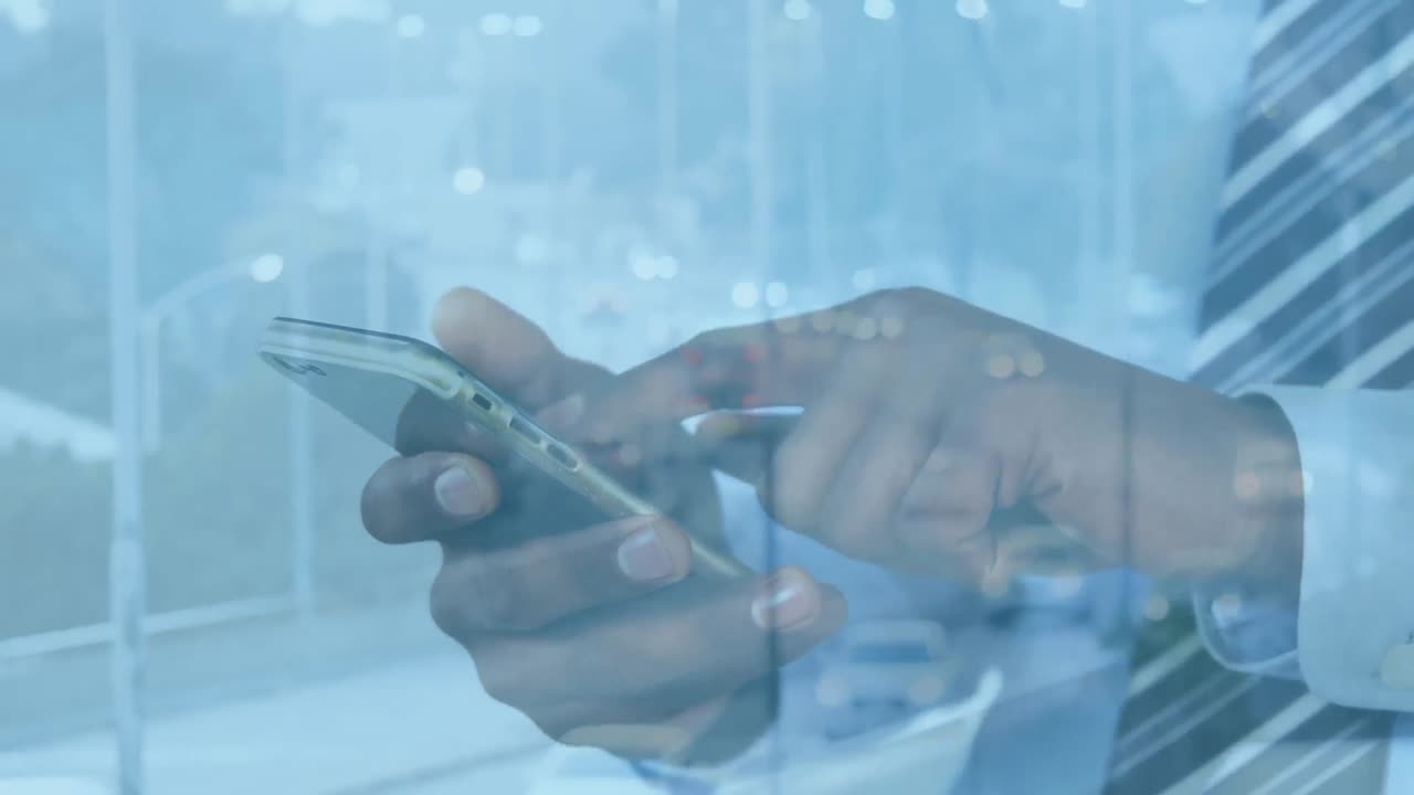 Animation of cars on street over african american businessman using smartphone