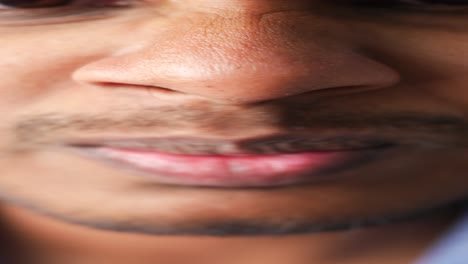 closeup of a man's face, showing his nose, mouth, and lips.