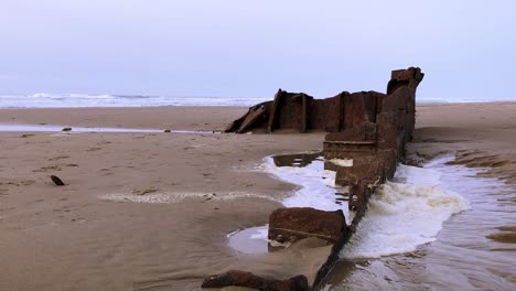 a piece of the sujameco shipwreck exposed during low tide at horsfall beach near coos bay, oregon