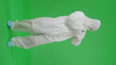 person in protective suit on green screen
