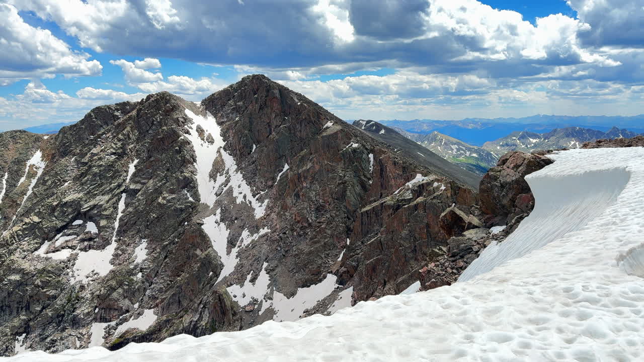Mount of the Holy Cross 14er snow field summer afternoon Rocky Mountain Sawatch Range Peak Colorado Alpine backcountry landscape Notch Mountain Shelter Halo Ridge trail catwalk cornice pan left