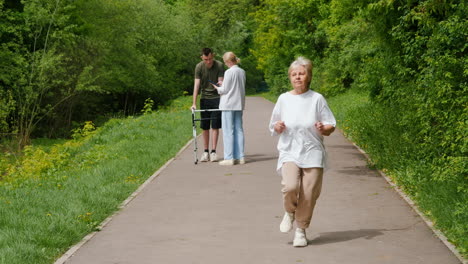 senior woman receiving assistance while walking in a park