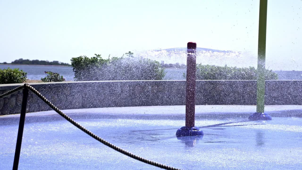 Water sprays up from vibrant structures, creating joyful moments amidst laughter and play