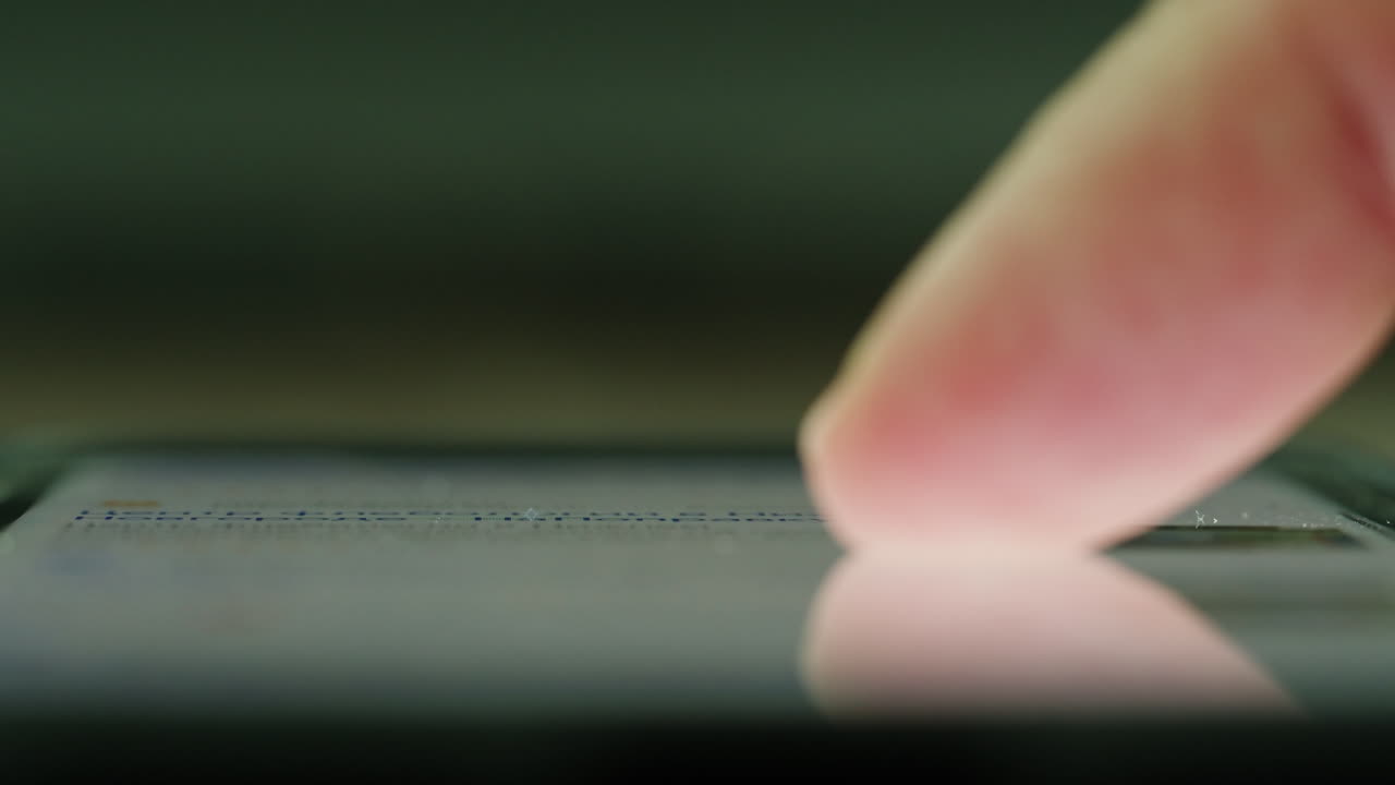 Finger touching smartphone screen