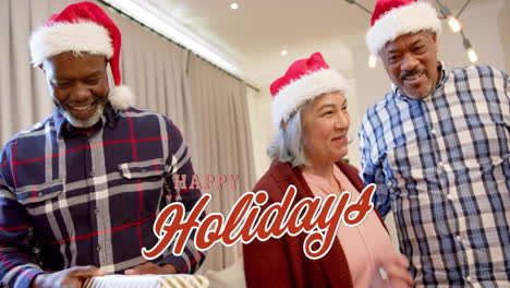 animation of holidays text over diverse senior friends celebrating christmas at home