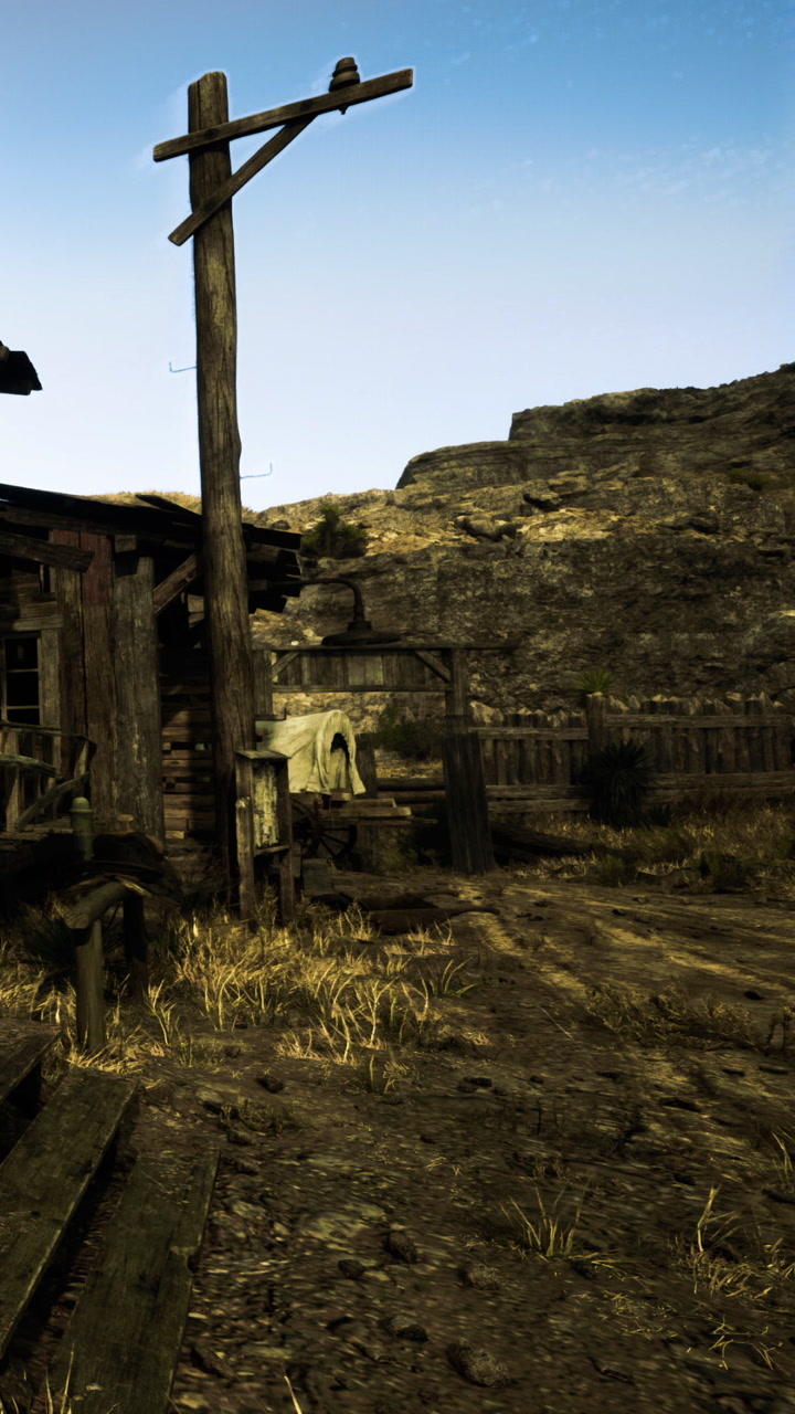 Old wooden structure near rocky landscape during bright daylight