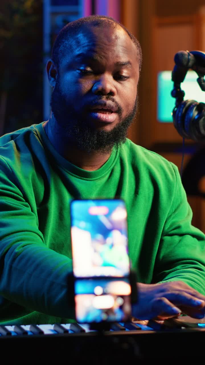 African American Musician Playing Keyboard and Talking on Live Stream