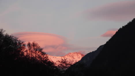 Pink-clouds-moving-above-Switzerland-alps