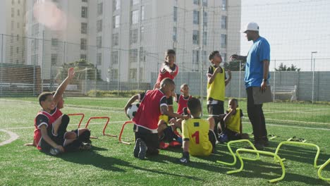 soccer kids exercising in a sunny day