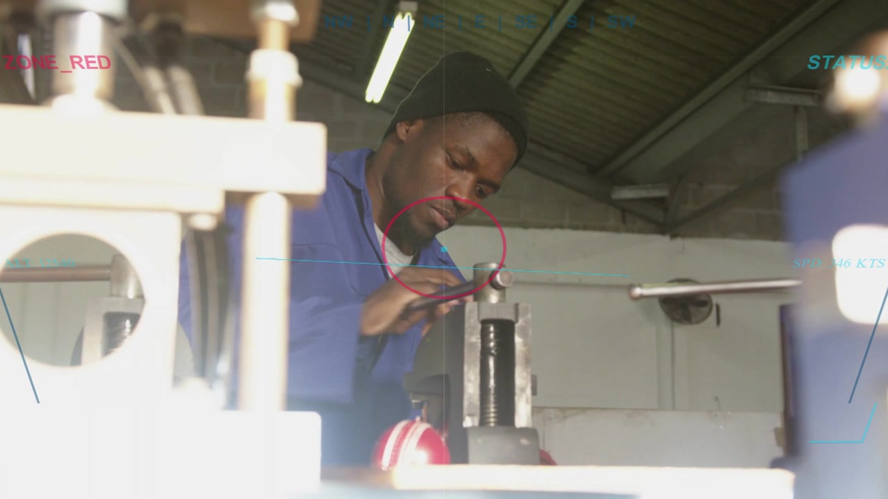 Man leaning inspecting clamped shaft, then grasping lever tightening vise for metalwork clamping