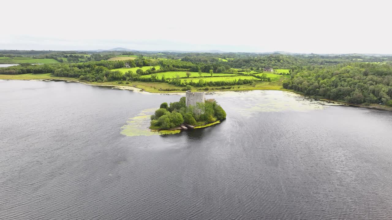 Cloughoughter Castle in small lake island and Irish green landscape. Co. Cavan, Ireland