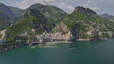 amalfi italy aerial v5 cinematic flyover azure sea capturing picturesque landscape of secluded coastal atrani town village nested within mountain valleys in summer - shot with mavic 3 cine - may 2023