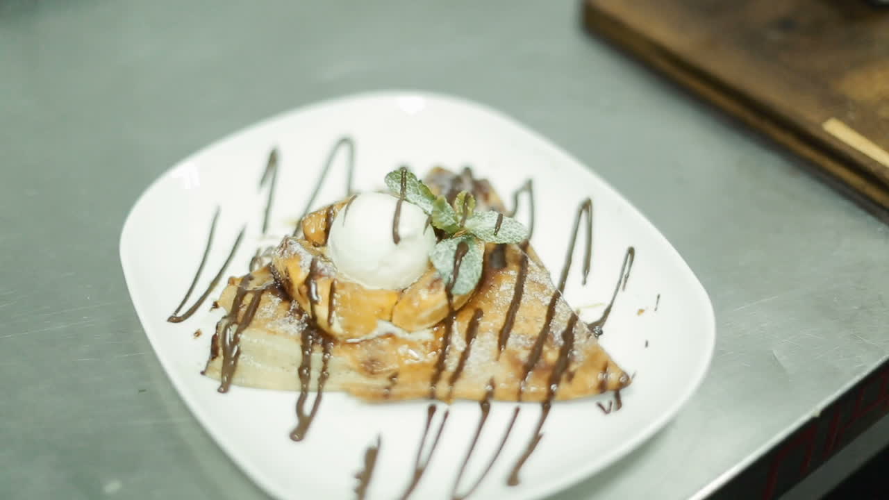 Delicacy In The Hands Of The Chief. Chief cook holding plate with delicacy