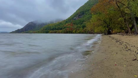 autumn beach and cloud timelapse in new york's hudson valley at little stony point in the hudson highlands over the hudson river