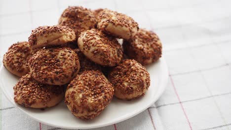 pile of sesame seed cookies on a plate