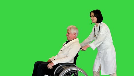 nurse pushing a patient on a wheelchair on a green screen, chroma key