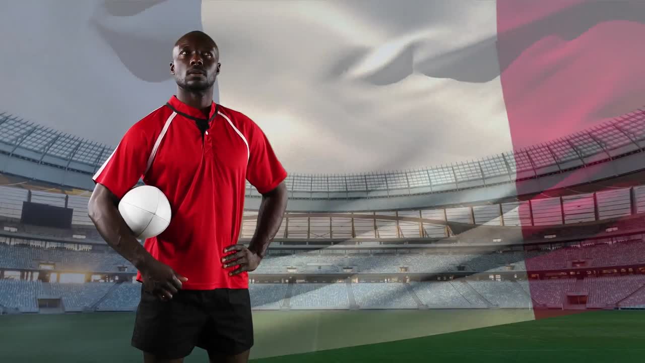 Jogador de rugby profissional de pé em frente a uma bandeira e um estádio